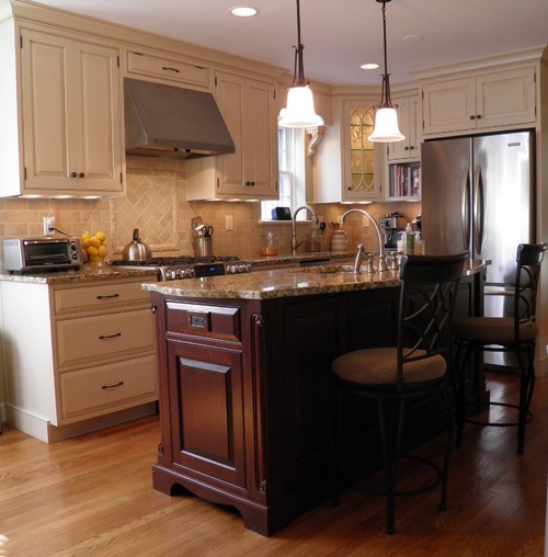 Antique White Base and Wall cabinets and Cherry Tone Island Cabinets with Giallo Napoleon Granite